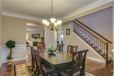 Dine in elegance!  This spacious dining area features gorgeous wainscoting and hardwood floors.