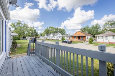 Wooden terrace featuring a yard