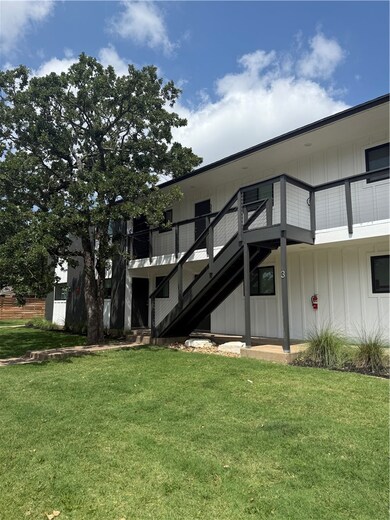 Back of property featuring board and batten siding