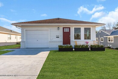 front shrubs and chairs or porch seating