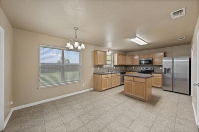 Kitchen featuring stainless steel appliances, a c