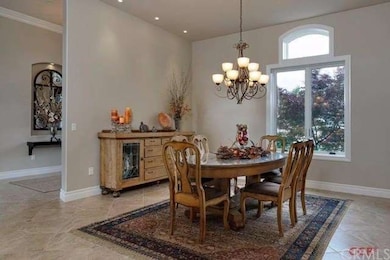 The dining room sits near the kitchen and has plen