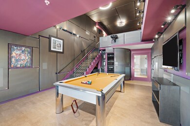 This contemporary game room is a luxury enthusiast
