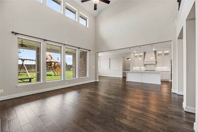 This living area with a comfortable and inviting feel offers the perfect setting for keeping everyone close and the conversation going. Lounging, entertaining guests, enjoying family time... this space delivers.