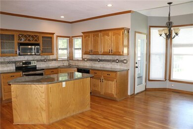 Large, bright kitchen open to breakfast room and f