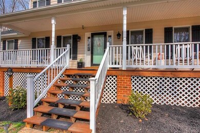 Enjoy this peaceful setting from the full-width wrap around front porch that measures 6' in width.
