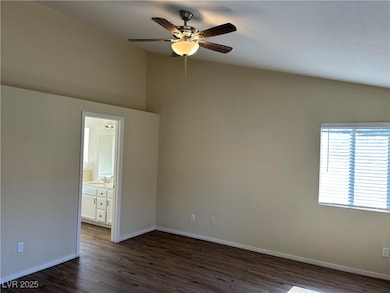 Unfurnished room featuring a sink, a ceiling fan,