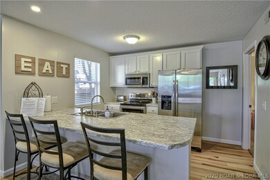 The kitchen follows the open and bright feel of th