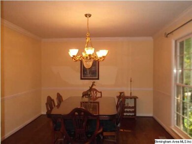 FORMAL DINING ROOM WITH HARDWOOD FLOORS.
