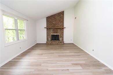 Family Room with Peaked Ceiling and Fireplace
