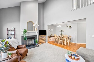 Spacious living room has a gas fireplace and is open to the dining area; great for entertaining.
