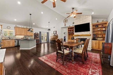 Dining room with plenty of natural light, a firep