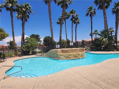 Community pool with a patio area