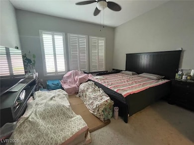 Bedroom featuring carpet floors and a ceiling fan