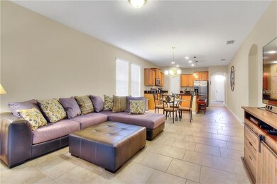 Great room:  Neutral colors. Tile flooring.  Slidi