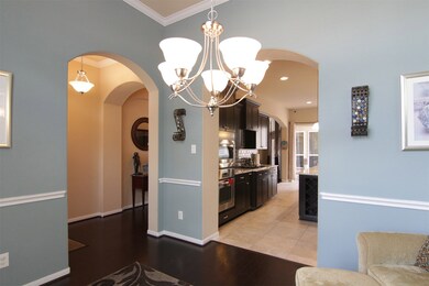 left arch from foyer, right arch to kitchen; dark