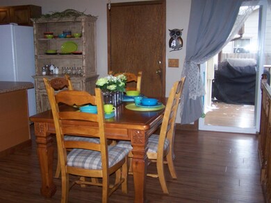Open to Kitchen and Living Room. Wood laminate flo