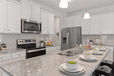 Kitchen featuring appliances with stainless steel 