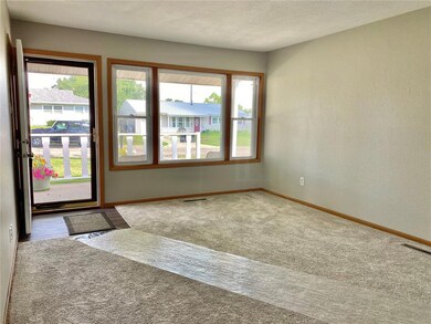 Living room with large windows and plenty of natur