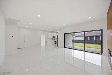 Empty room featuring light marble finish floors, r