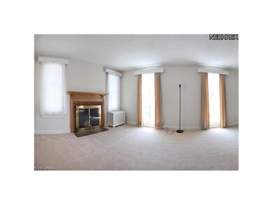 This living space includes newer carpet, two full-