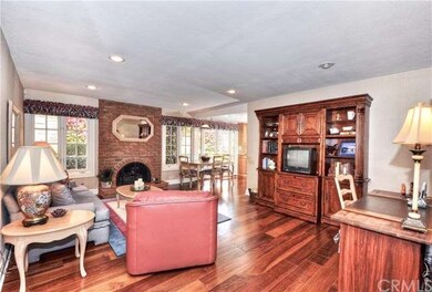 Spacious family room with fireplace, beautiful win