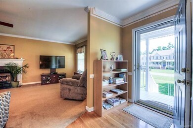 Foyer with a Sneak Peak Into Spacious Family Room