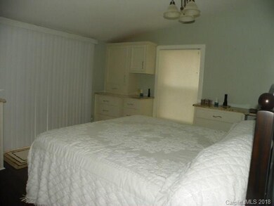Master Bedroom with glass door opening to covered 