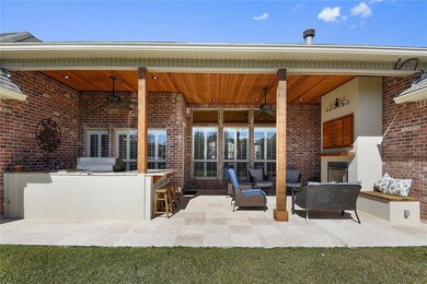Outdoor kitchen and fireplace for entertaining gue