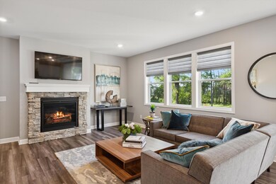 (Photo of a decorated model, actual homes finishes will vary) Such a spacious great room!