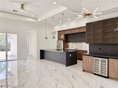 Kitchen featuring wine cooler, modern cabinets, st