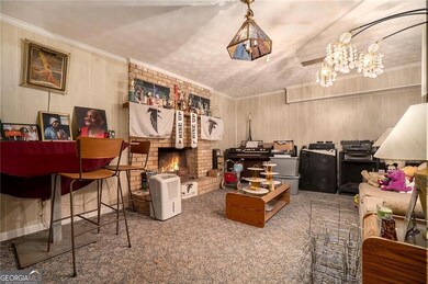 Carpeted living room featuring ornamental molding
