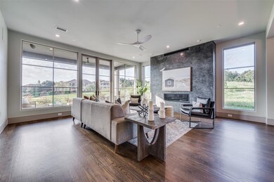 Living area with baseboards, a fireplace, a ceilin