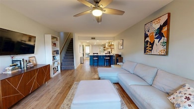 Living room featuring light wood-type flooring, ce