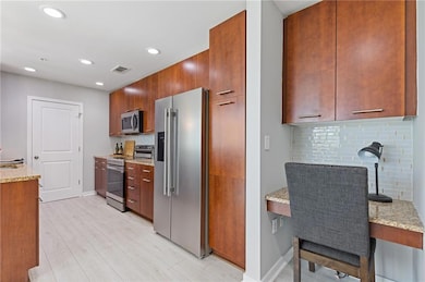 Updated Kitchen with Granite counters offers loads of cabinet & counter space!