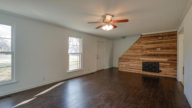 Great Room and living room facing stairs and newly build wooden wall.