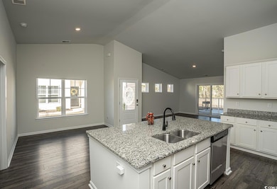 Kitchen with light stone counters, stainless steel