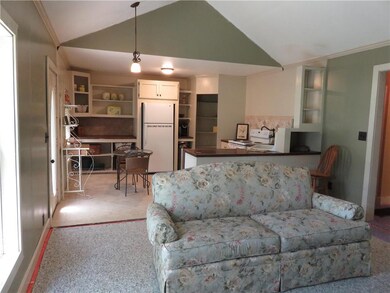 View from living room into kitchen.  New carpet no