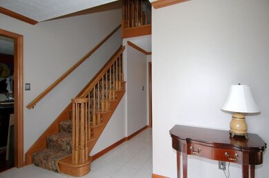 Step into a spacious 13x6 entry.  The doorway to t