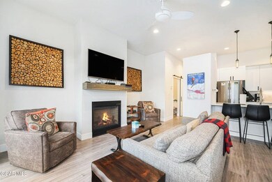 Living room with baseboards, recessed lighting, a