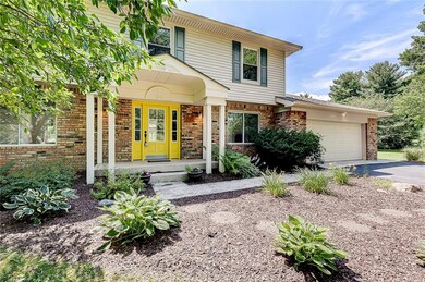 This is a traditional 4 bedroom house with 2.5 baths. A bright door peeks out from the shade trees to welcome you home!