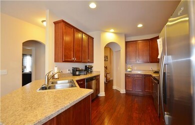 Kitchen With Hardwood Flooring And Stainless Steel