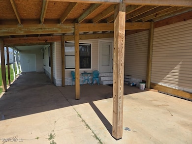 View of patio featuring a carport