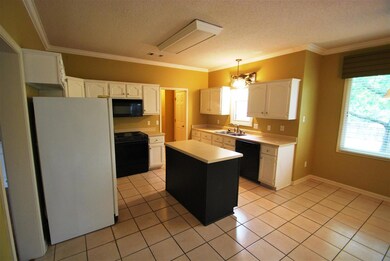 great kitchen with a half bath just into the hallw