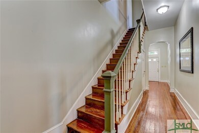 Archway opens to spacious front foyer.  Front door