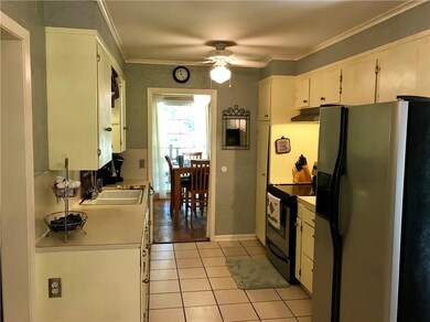Kitchen looking into formal dining area.