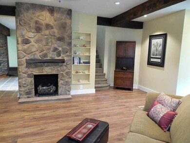 Living Room. The handcrafted stone floor to vaulte