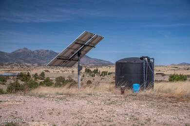 SOLAR WELL & TANK IN PASTURE