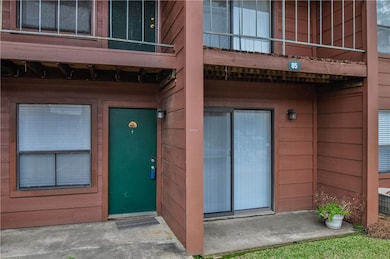 Property entrance with a balcony