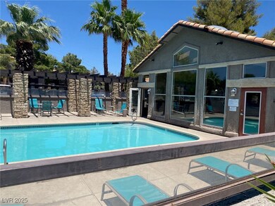 Community pool featuring a patio